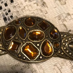 Belt in bronze gold stretches 34 to 42 inch waist